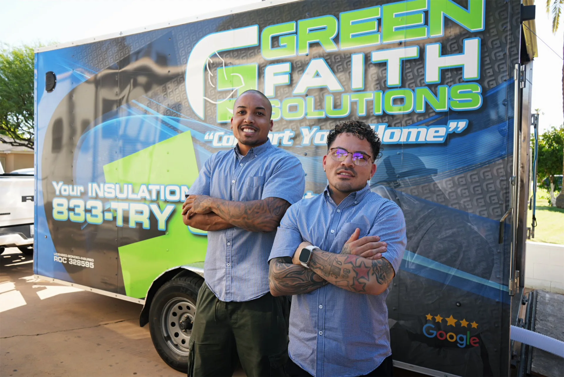 Green Faith Solutions team members beside the company trailer